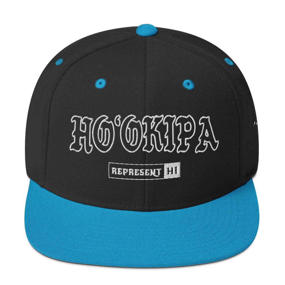 HoʻOkipa Snapback Hat — Black/ Teal — front view
